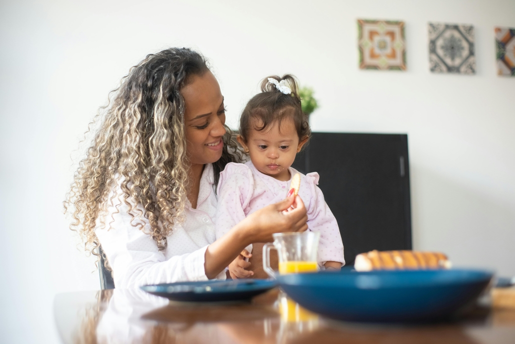 Mother feeding a young child