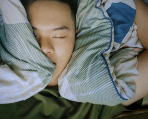 Person sleeping soundly with trusted asthma specialist care in the greater Philadelphia region.