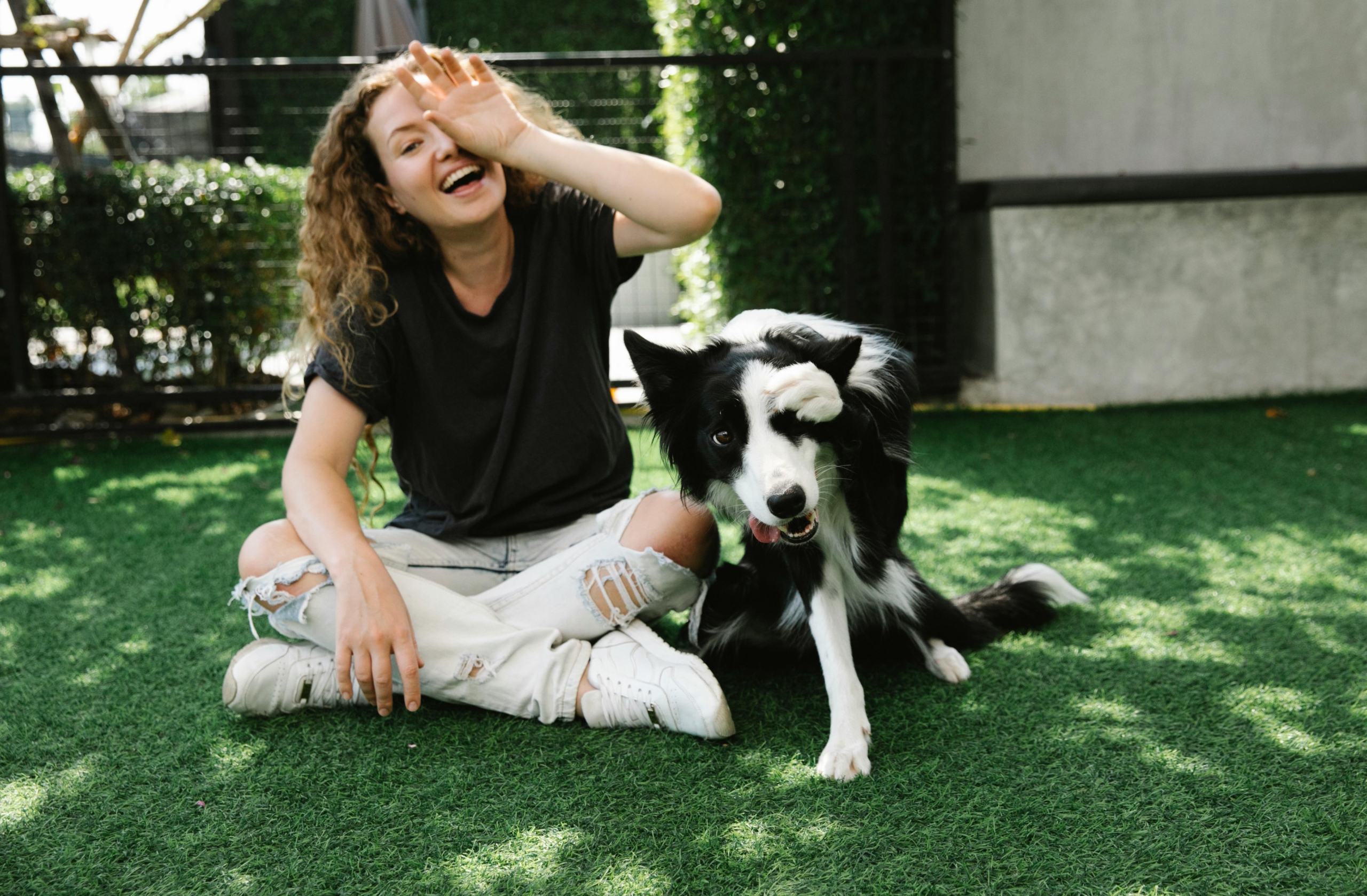 Woman and dog at home in the Philadelphia area, living free from pet allergy symptoms