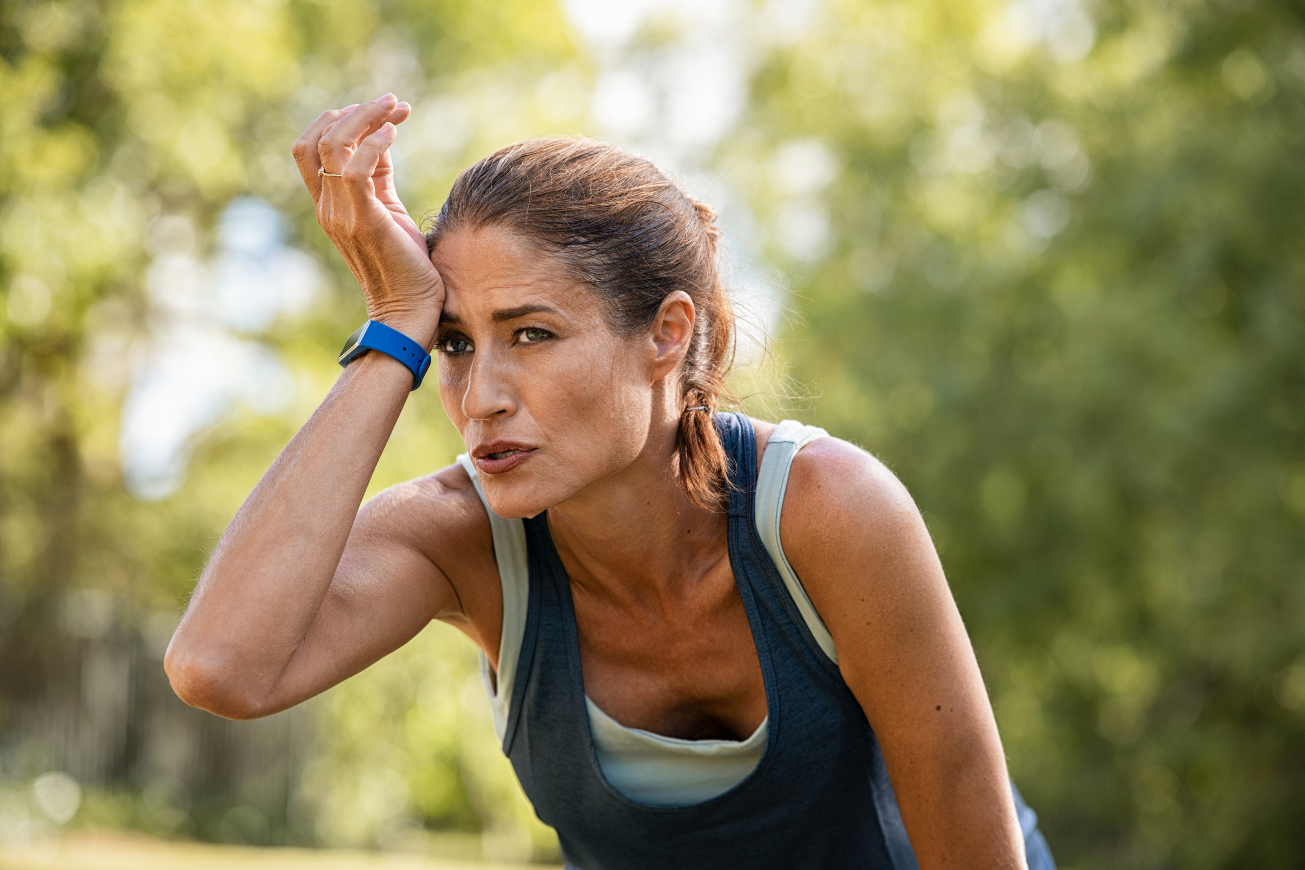 Woman on a run in the summer heat